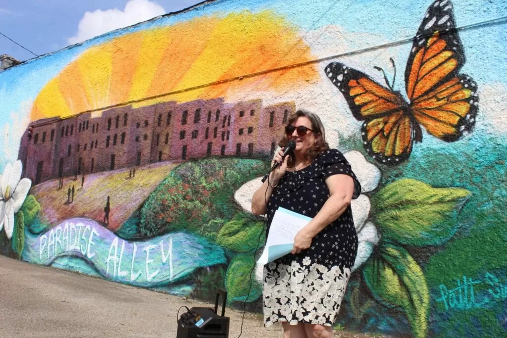 Tina Robbins in front of a mural in Aberdeen.